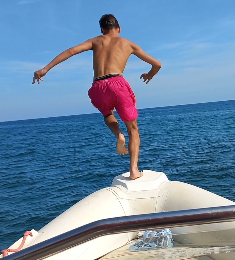 Guest jumping off the boat into the sea